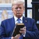 Trump Holding Bible